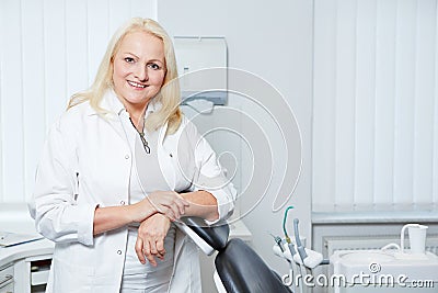 Senior denist in her dental practice