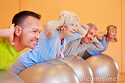 Senior group exercising in fitness