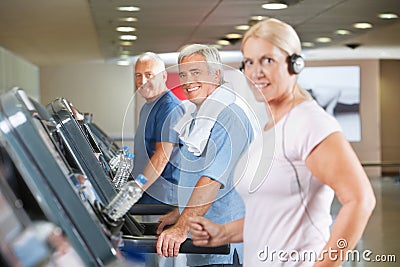 Senior group on treadmills in gym