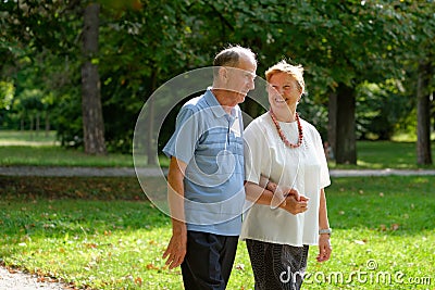 Senior happy couple walking
