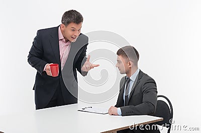 Senior and junior business people discuss