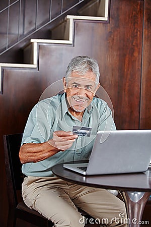 Senior man doing online shopping with credit card