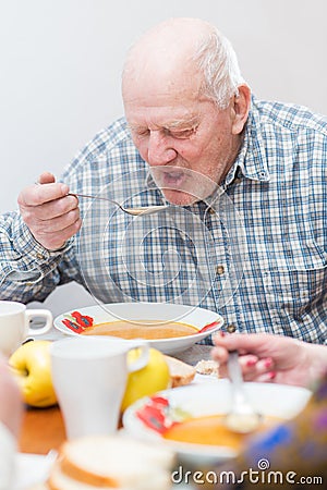 Senior man eating