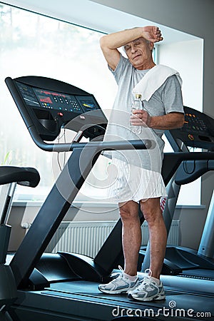 Senior man in a fitness club