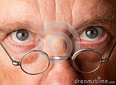 Senior man with focus on glasses