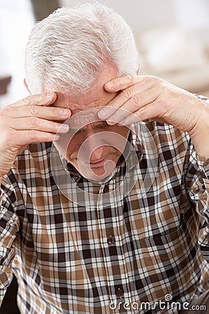 Senior Man Looking Stressed At Home