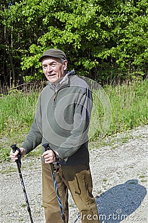 The senior man by nordic walking