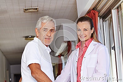 Senior man with nurse in hospital