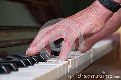 Senior man playing piano