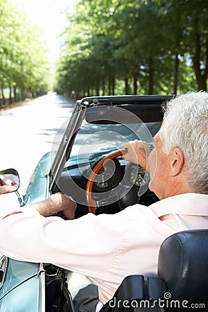 Senior man in sports car