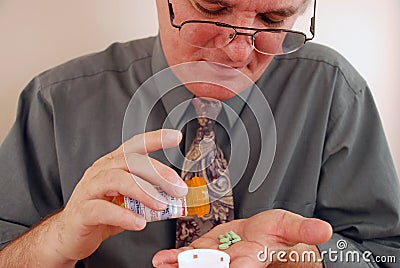 Senior Man Taking Medication