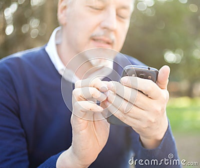 Senior man using his cell phone