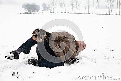 Senior man winter accident fall on snow