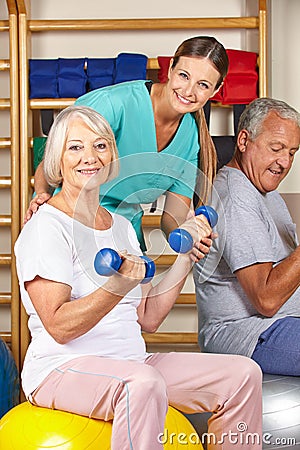 Senior man and woman in gym doing