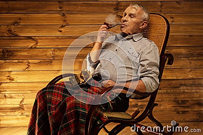 Senior man in wooden interior