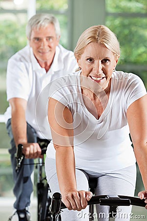 Senior people exercising in gym
