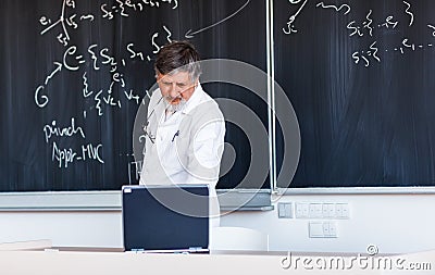 Senior professor writing on the board