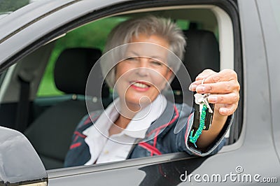 Senior woman in car
