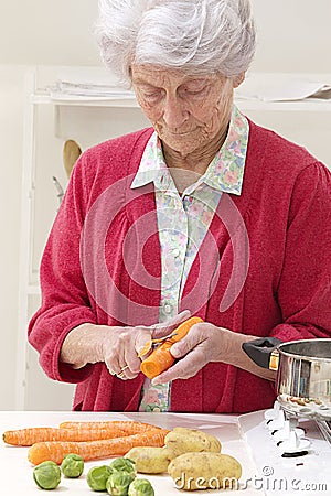 Senior woman cooking in the kitchen