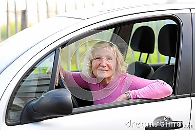 Senior woman driving the car