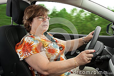 Senior Woman Driving a Car