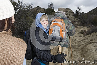 Senior Woman With Family Hiking