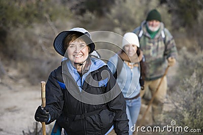 Senior Woman With Family Hiking