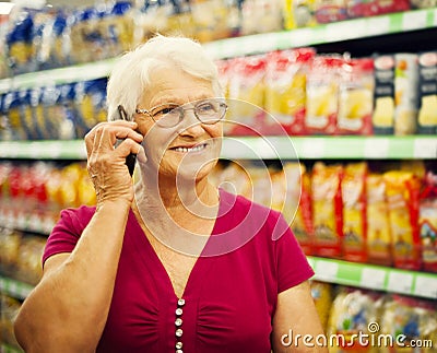 Senior woman in groceries store