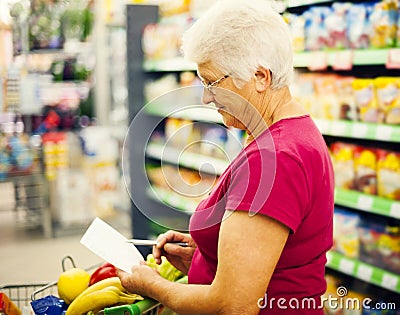 Senior woman in groceries store
