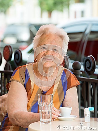 Senior woman having a cup of coffee