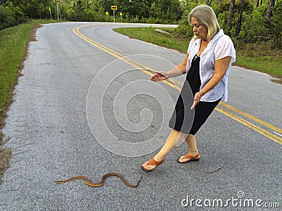 Senior Woman - Helps Snake