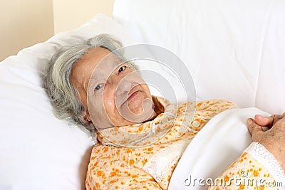 Senior woman in the hospital bed