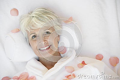 Senior Woman Lying On Massage Bed