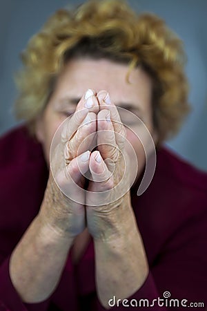 Senior woman praying