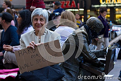 Senior woman with protest sign at Occupy Wall Street