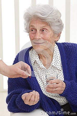 Senior woman receiving medication