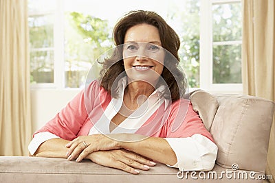 Senior Woman Relaxing In Chair At Home