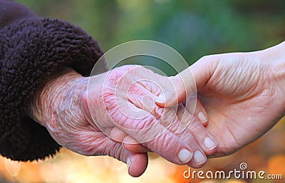 Senior woman s hand and helping hand