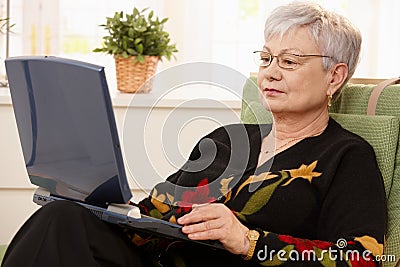 Senior woman using laptop computer