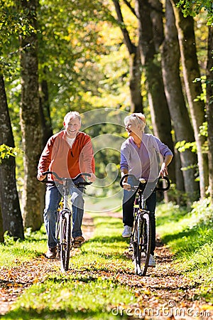 Seniors exercising with bicycle