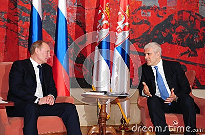 Serbia s President B.Tadic (R) talks with Russia s Prime Minister V.Putin