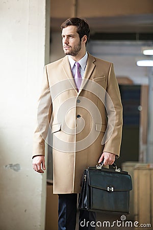 Serious and elegant business man walking away