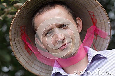 Serious man in vietnam hat