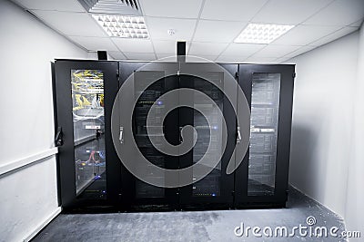 Server room with black metal computer cabinets