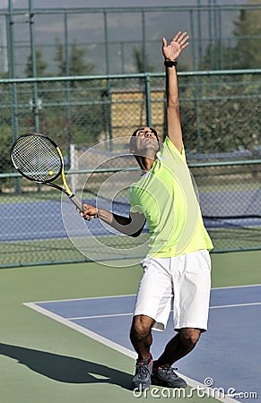 Serving a tennis ball