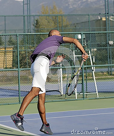 Serving a tennis ball