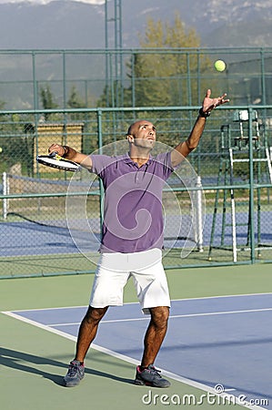 Serving a tennis ball