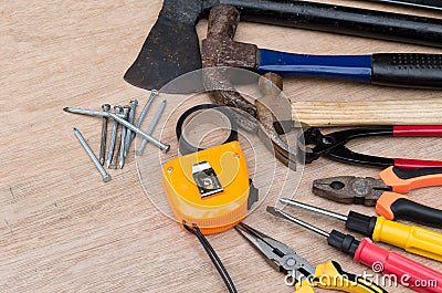 Set of different tools for work on wood background