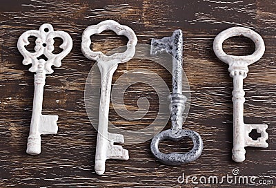 Set of four antique keys, one being different and upside down