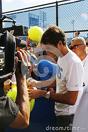 Seventeen times Grand Slam champion Roger Federer signing autographs after practice for US Open 2014